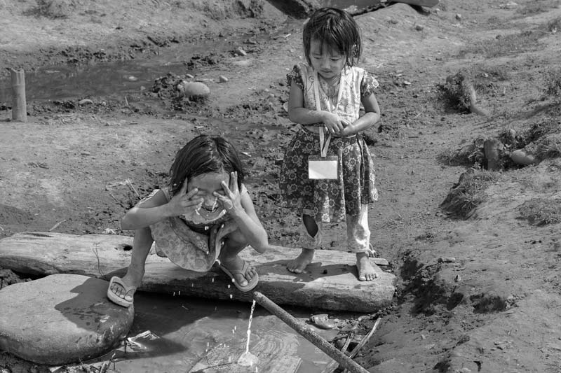 Impediments to enjoyment of Human Right to Water: 'Accessibility' Norm - Children using the same unhygienically maintained water source shown earlier in East Siang district, Arunachal Pradesh